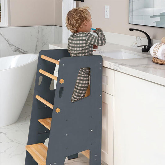 Wooden learning tower designed for toddlers to participate in daily activities